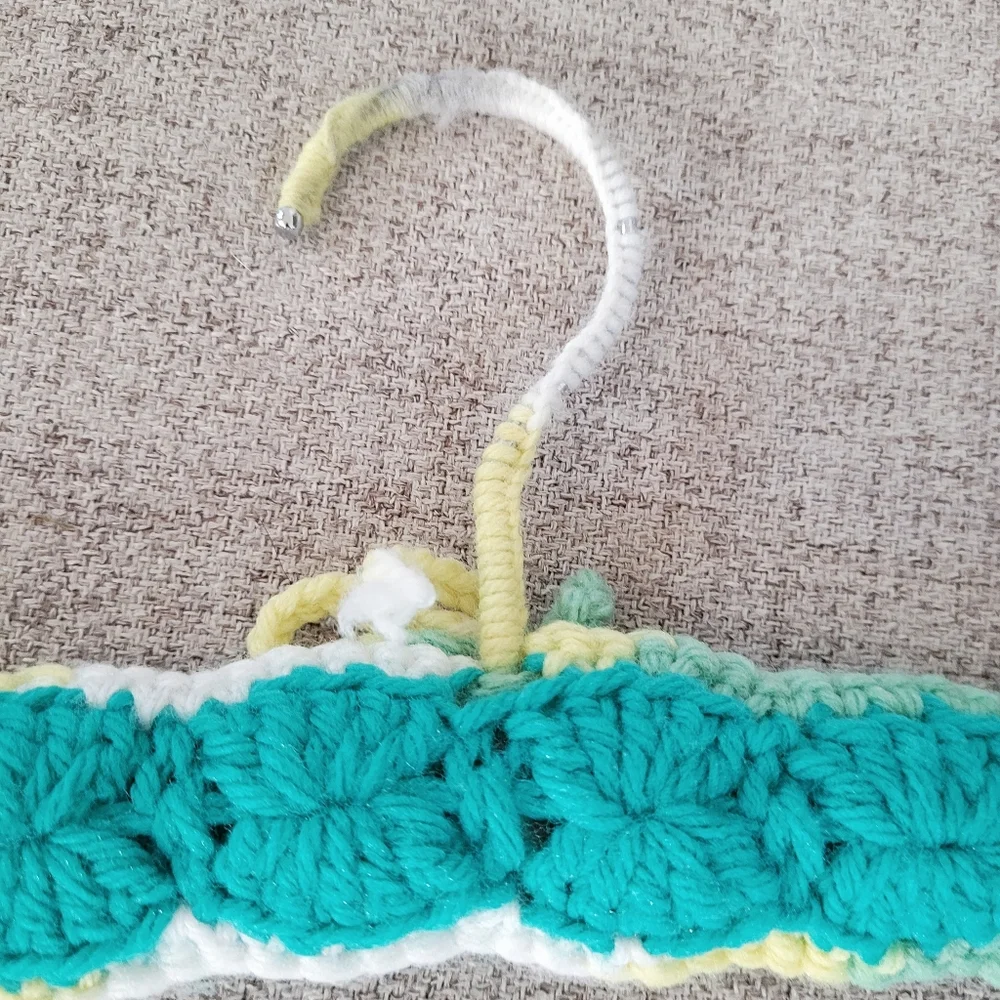 Vintage handmade knit clothing hanger